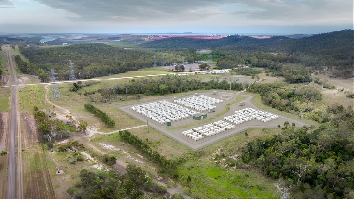 Aerial view of white BESS units in a cleared rural site surrounded by native trees