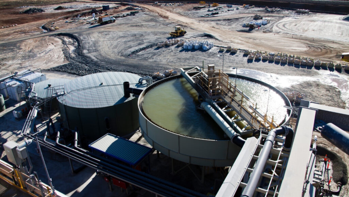 Large-scale lithium refining tanks and pipelines at an active processing facility