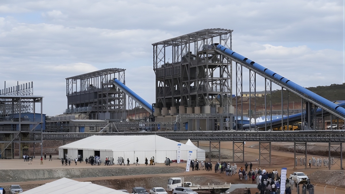 Spodumene calciner facility with blue conveyors and steel framework